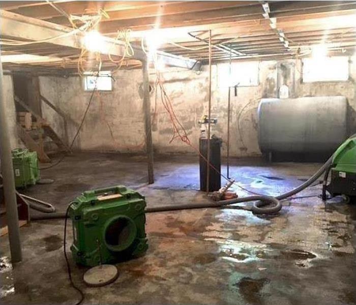 soaked and flooded basement after storm damage