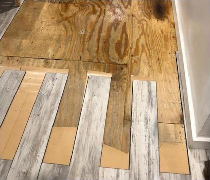 removing wood floor planks after water damage to subflooring 